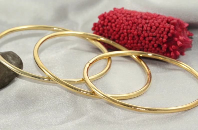 how to layer gold bracelets