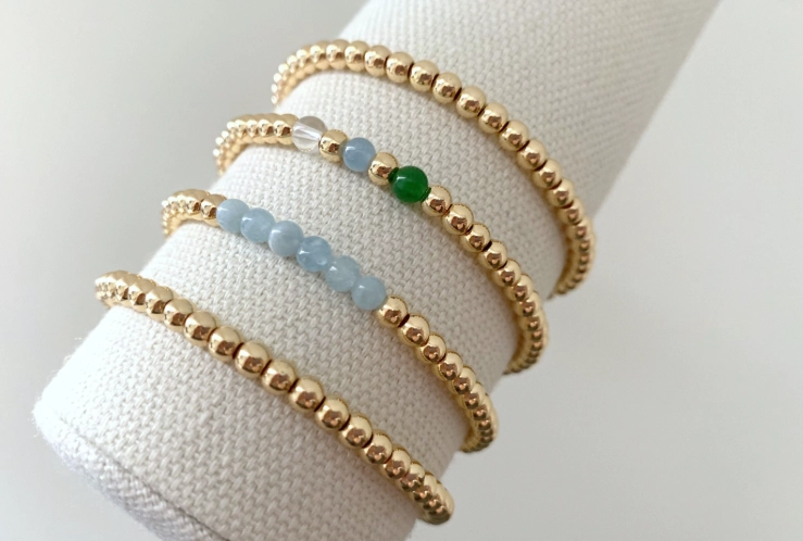 how to layer gold bracelets
