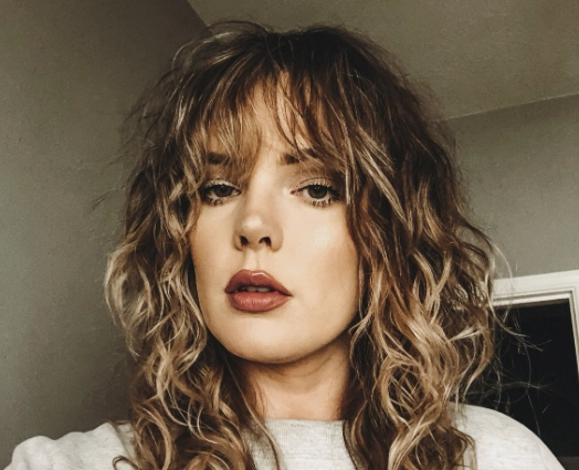 long layers with curtain bangs wavy hair